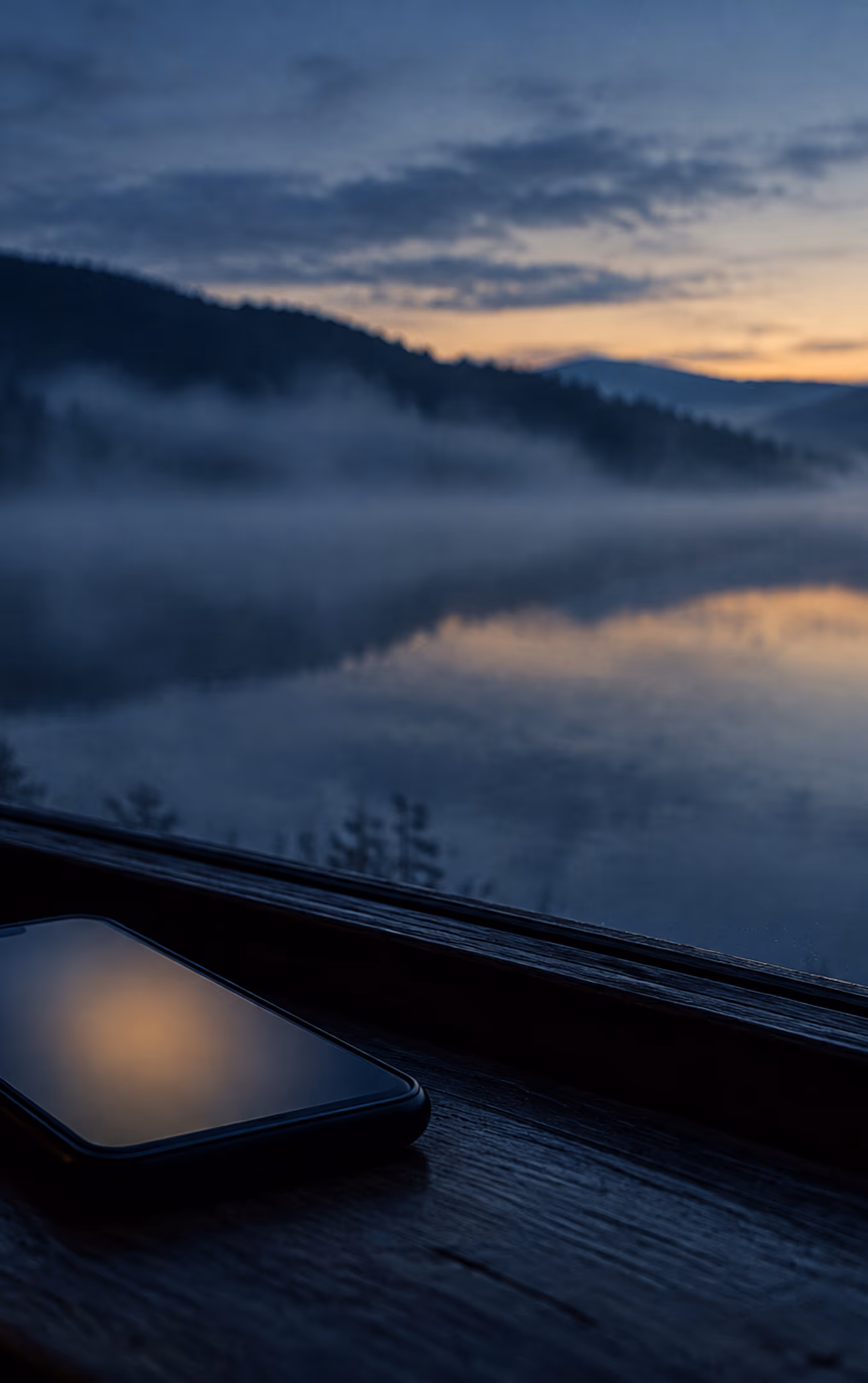 Mountain lake under a cloudy sky.